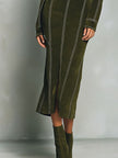 Olive green FJØRNA high neck zip-up midi dress with contrast stitching, showcasing the fitted silhouette and stylish design.