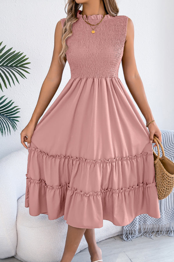 FJØRNA sleeveless midi dress with patchwork design, solid color, and tucked details, perfect for casual occasions.