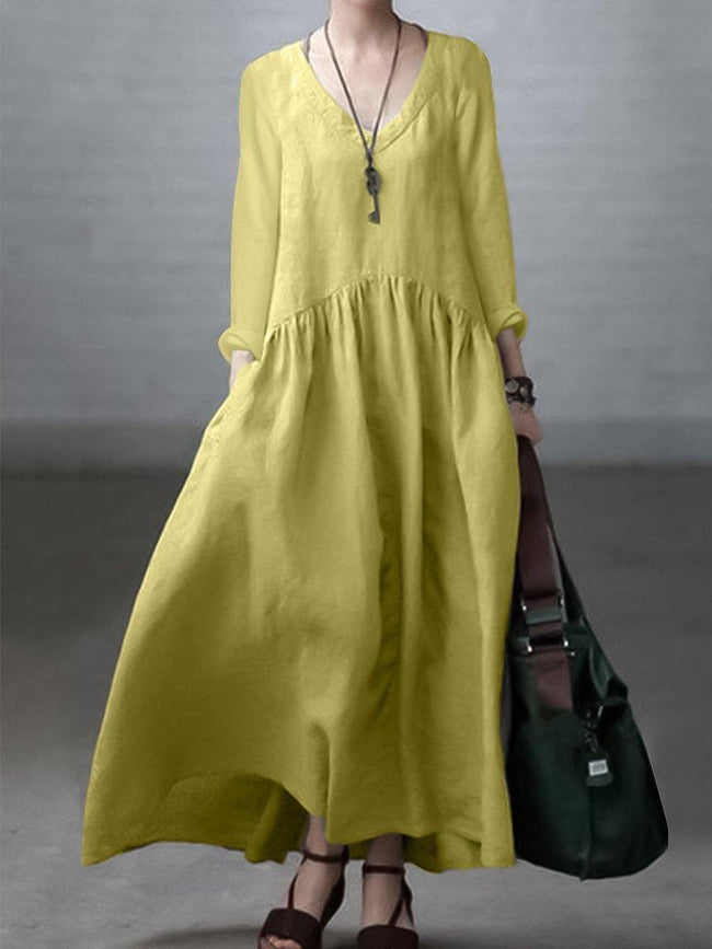 FJØRNA loose V-neck cotton and linen dress, casual wedding dress with relaxed fit and breathable fabric, shown on a model.