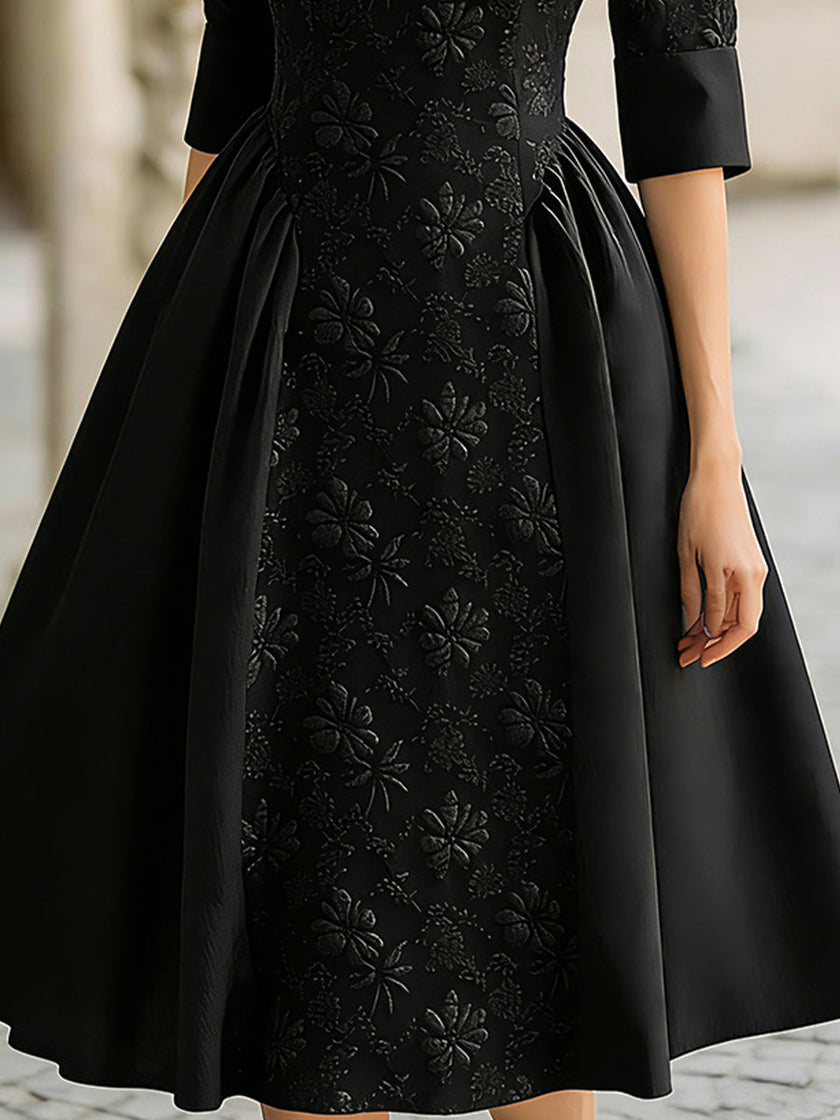 FJØRNA elegant jacquard short-sleeve A-line midi dress for women, showcasing a stylish, fitted design with intricate fabric pattern.