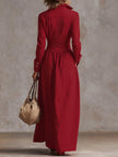 FJØRNA high waisted maxi dress with long sleeves, button details, pleated pockets, split-joint lapel, solid color design