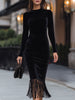 FJØRNA velvet long-sleeve midi dress with fringe hem, showcasing a flowing midi dress design in rich velvet fabric.