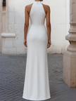 Elegant satin pleated halter-neck evening gown by FJØRNA, featuring a flowing design and sophisticated style.