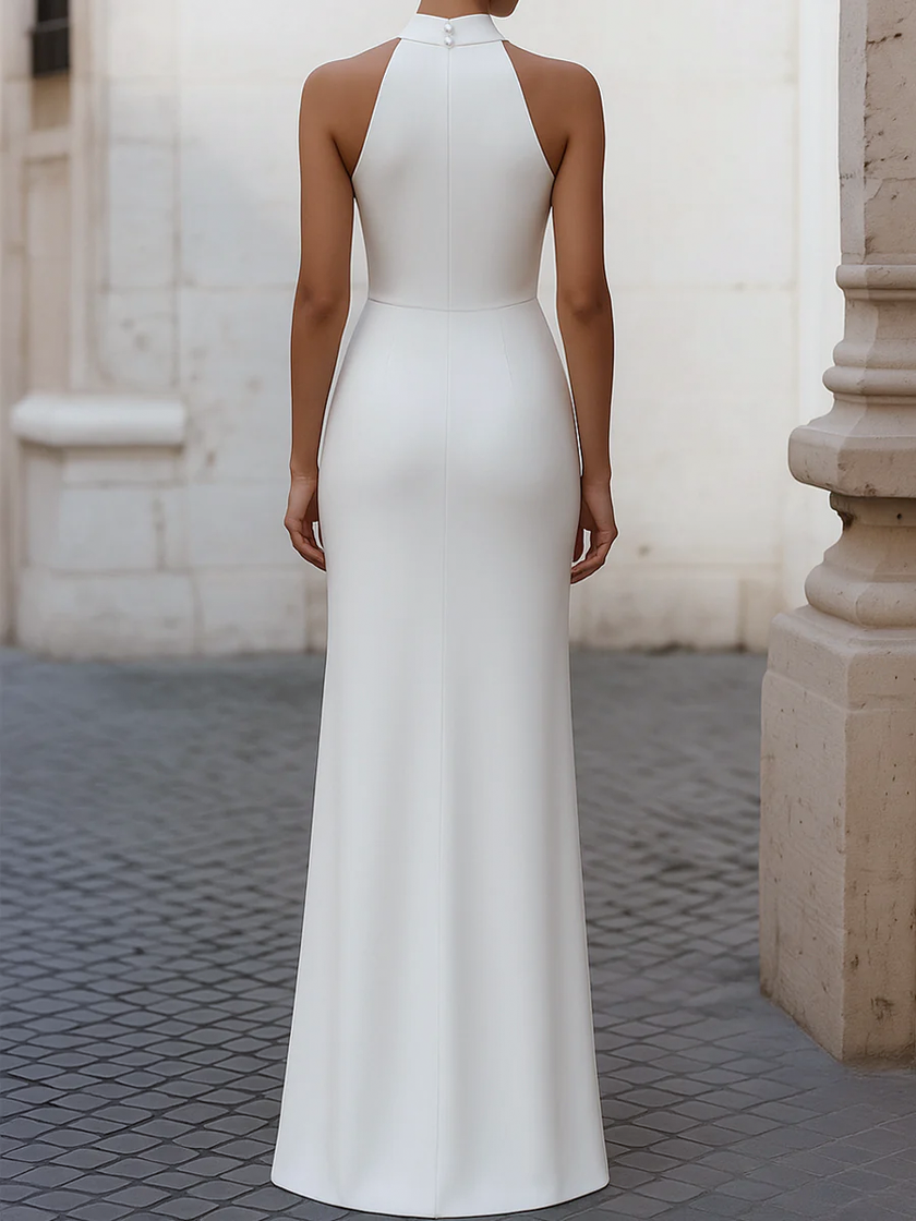Elegant satin pleated halter-neck evening gown by FJØRNA, featuring a flowing design and sophisticated style.