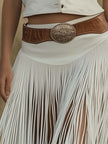White suede tassel dress by FJØRNA featuring a casual style with tassel details and a relaxed fit.