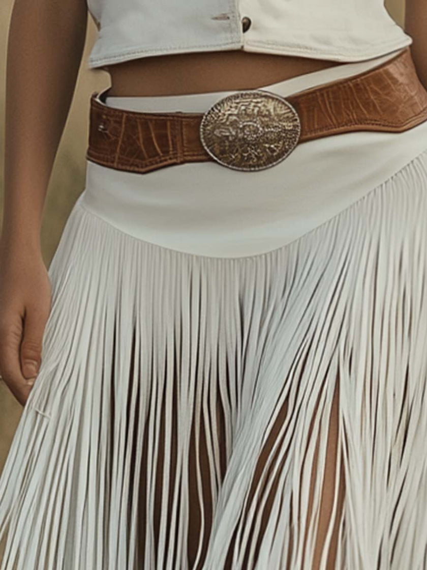 White suede tassel dress by FJØRNA featuring a casual style with tassel details and a relaxed fit.