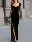 FJØRNA black velvet sweetheart gown with sheer sleeves, elegant black maxi dress with fitted bodice and flowing skirt.
