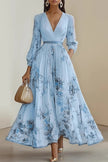 FJØRNA printed V-neck long sleeve maxi dress with bow tie waist, perfect for holiday occasions, featuring vibrant floral pattern.