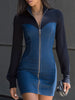 FJØRNA denim paneled zip-front mini dress showing a fitted silhouette with long sleeves and front zipper detail.