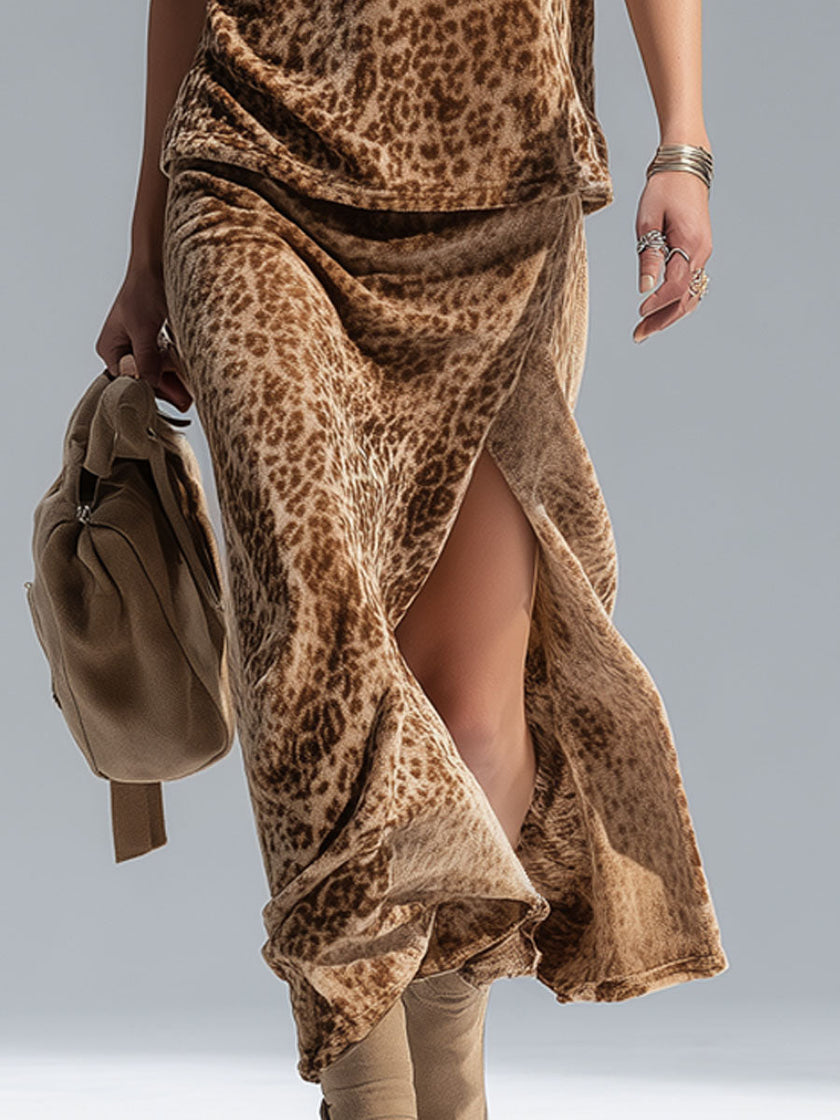 Leopard print sleeveless vest and velvet split-hem skirt set by FJØRNA, featuring bold animal pattern and luxurious fabric details.
