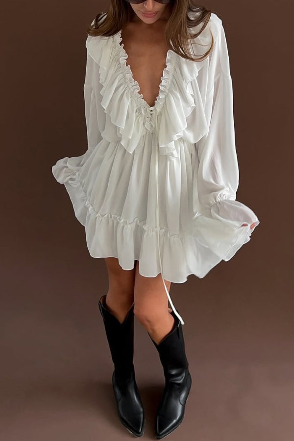 FJØRNA solid color V-neck ruffled long-sleeved vacation mini dress with ruched details, ideal for casual or wedding occasions.