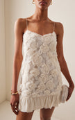 FJØRNA Blanc Rosette-detailed Georgette Mini Dress showing delicate rosette embellishments and flowy fabric detail.