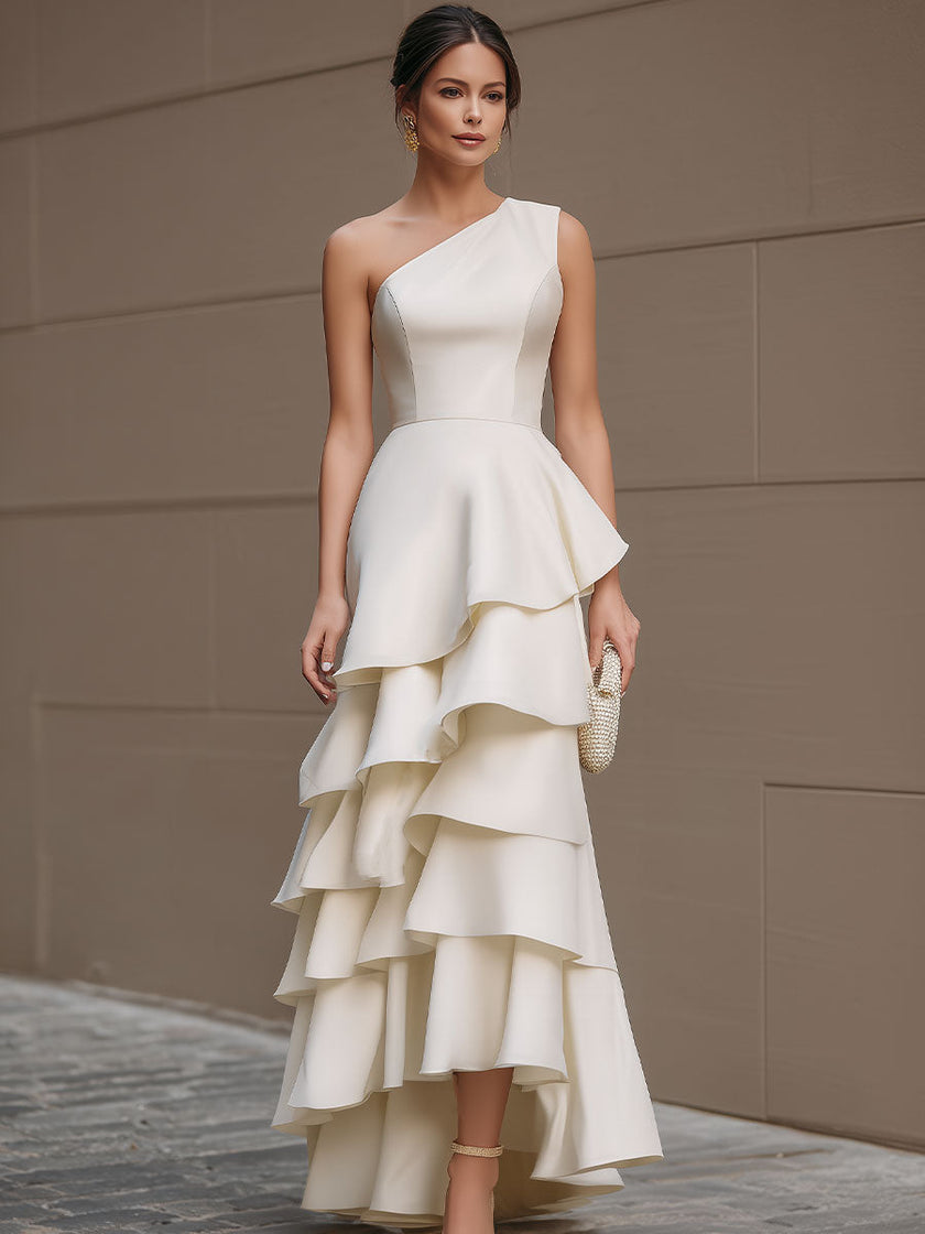 Ivory FJØRNA one-shoulder tiered ruffle maxi dress for women, featuring a flowing white gown with layered ruffles and elegant design.