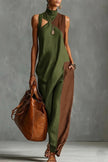 FJØRNA color-blocked high-neck sleeveless casual maxi dress with pockets, featuring bold contrast panels and a flowing silhouette.