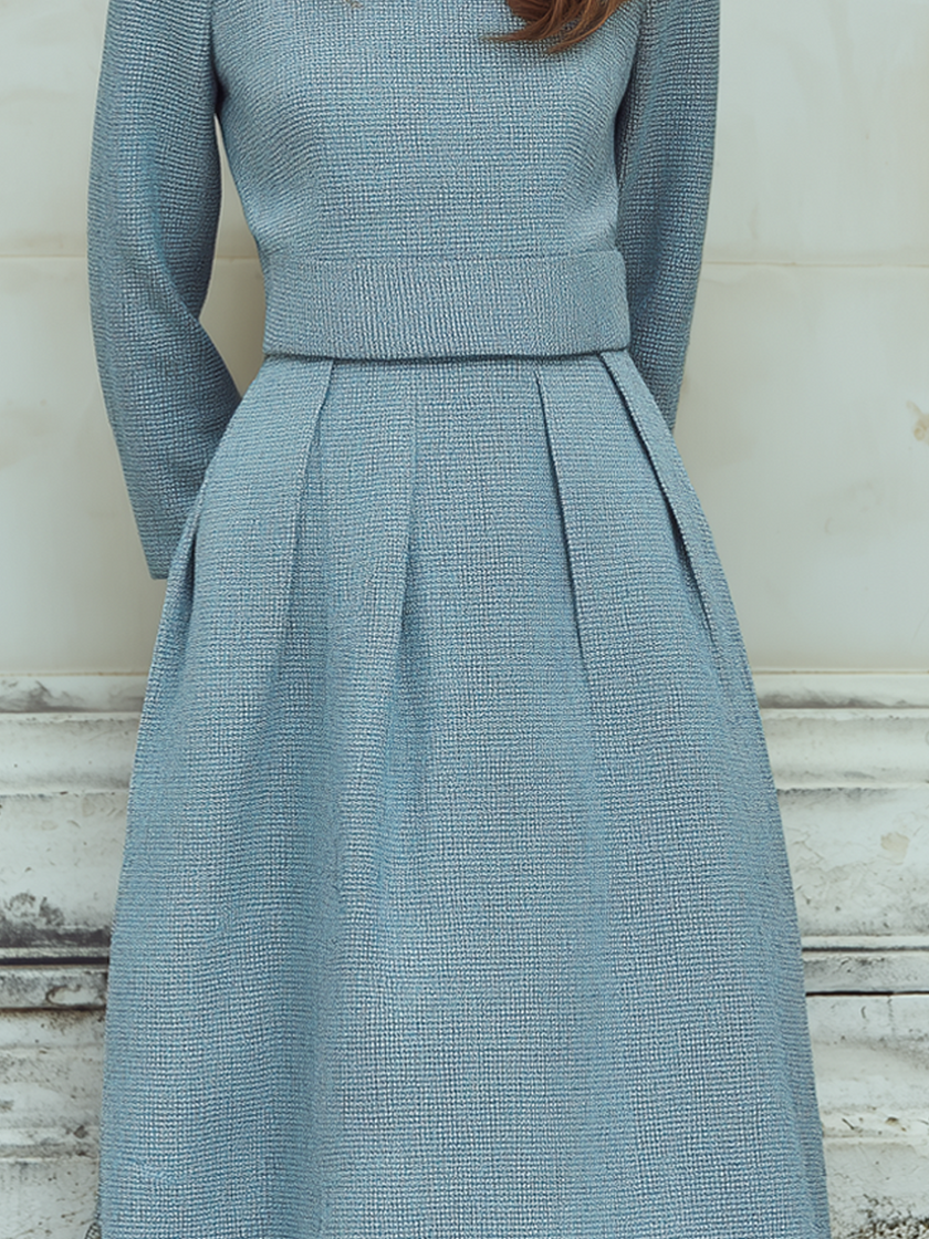 FJØRNA vintage tweed long-sleeved midi dress with classic pattern, tailored fit, and elegant style displayed in the image.