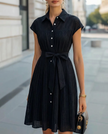 FJØRNA elegant sheer pleated high-neck button-up midi dress for women, flowing fabric and sophisticated design.