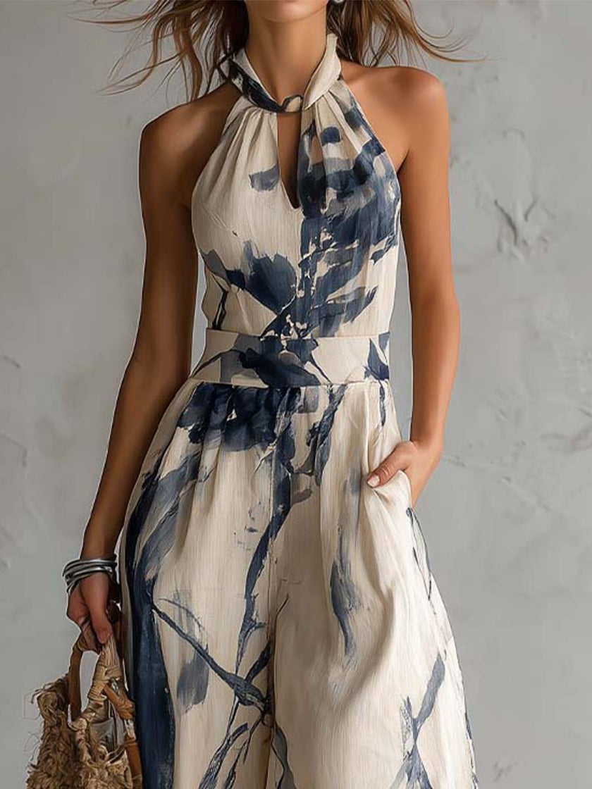 White ink wash print sleeveless halter neck wide-leg jumpsuit by FJØRNA with pockets, stylish and comfortable for casual wear.