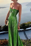 FJØRNA Celeste women's strapless A-line evening gown with pleated metallic fabric, elegant and stylish for formal occasions.