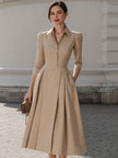 Beige FJØRNA shirt-collar pleated midi dress for women, featuring a classic collar, pleats, and midi length in a stylish design.