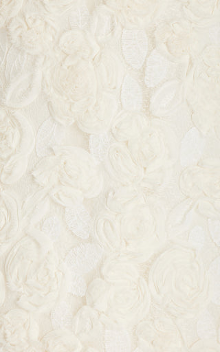 FJØRNA Blanc rosette-detailed georgette mini dress featuring delicate floral accents and lightweight, flowing fabric.
