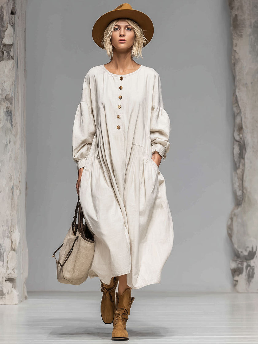 FJØRNA cotton button-front midi dress for women, featuring a classic design with a fitted waist and midi length, displayed on a model.