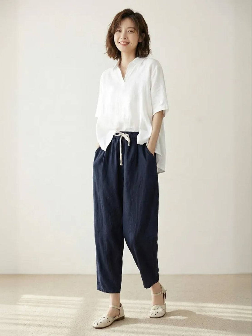 FJØRNA Felicity women's drawstring casual pants in relaxed fit, shown in beige fabric with adjustable waistband and side pockets.