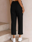 FJØRNA Felicity women's casual drawstring pants shown on a model, relaxed fit with waistband and lightweight fabric.