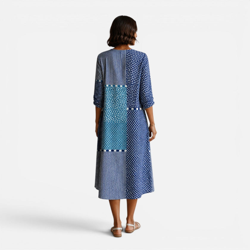 Women's FJØRNA Summer Boho Midi Dress featuring lightweight fabric, flowy silhouette, and bohemian style for warm-weather wear.