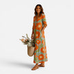 FJØRNA women's floral maxi dress with relaxed boho style, flowing fabric and vibrant floral pattern, perfect for summer wear.