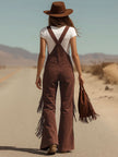 FJØRNA brown micro suede tassel wide-leg dungarees overalls, featuring tassel details and a relaxed fit on a model.