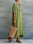 FJØRNA casual solid buttoned midi dress with a relaxed fit, perfect for casual weddings, displayed on a hanger.