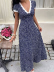 White lace patch floral V-neck maxi dress by FJØRNA with intricate lace details and flowing fabric, perfect for elegant occasions.