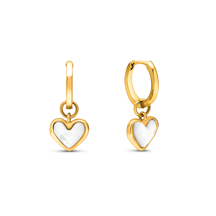 FJØRNA white quartz heart huggie earrings for women in gold, showcasing delicate jewelry design and sparkling quartz stones.