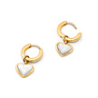 FJØRNA white quartz heart huggie earrings for women with gold accents, close-up view of the jewelry design.