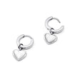 Silver FJØRNA White Quartz Heart Huggie Earrings for women, showcasing delicate heart-shaped white quartz stones in a stylish design.