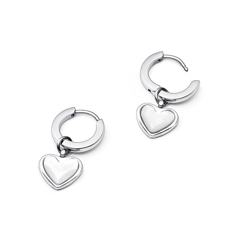 Silver FJØRNA White Quartz Heart Huggie Earrings for women, showcasing delicate heart-shaped white quartz stones in a stylish design.