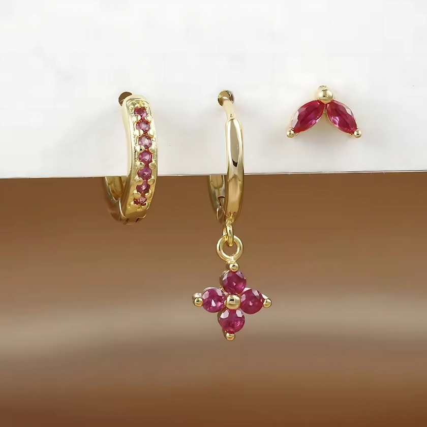FJØRNA unisex piercing set with gold and green accessories, featuring stylish hoops and studs for women’s jewelry.