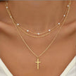 FJØRNA Lily 3-layer gold and silver necklace set for women with heart or cross pendants, featuring layered jewelry design.