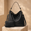 FJØRNA black vegan leather hobo shoulder bag for women with spacious interior and included pouch, stylish and eco-friendly.