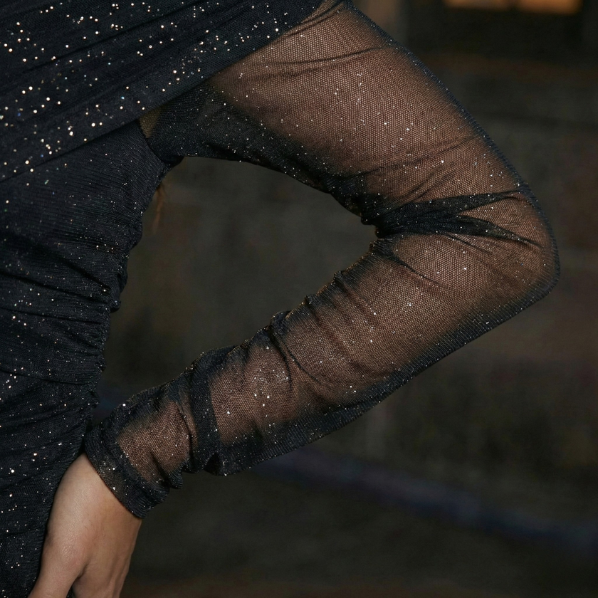 FJØRNA Ella women's mini dress in black with sparkle mesh fabric, size XS, featuring a stylish and fitted design.