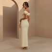 FJØRNA studio yellow maxi dress for women featuring off-shoulder Bardot style, backless design, and ruched detailing.