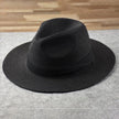 FJØRNA Carolous men's handcrafted classic Panama hat in white, featuring a wide brim and elegant design.