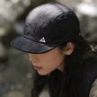 Black FJØRNA men's adjustable hat, packable baseball cap with a classic design and curved brim.