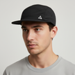Black men's FJØRNA adjustable hat with a packable design, featuring a classic cap style and a comfortable fit.