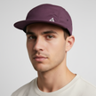 Black men's FJØRNA adjustable hat with a packable design, featuring a classic cap style and comfortable fit.
