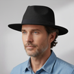 White handmade Panama hat for men by FJØRNA, unisex classic design with a wide brim and woven straw texture.