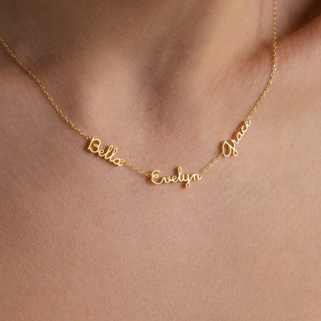 Dainty Elina custom name necklace by FJØRNA featuring two names in gold, 14 inches long, elegant personal jewelry.