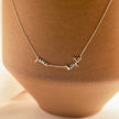 Dainty personalized gold unisex necklace with two names, featuring custom engraving, 14-inch length, by FJØRNA jewelry.
