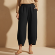 Black women’s wide leg trousers by FJØRNA with elastic waist and loose cotton fit, stylish and comfortable for casual wear.