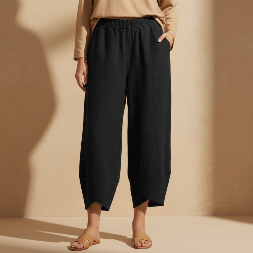 Black women’s wide leg trousers by FJØRNA with elastic waist and loose cotton fit, stylish and comfortable for casual wear.